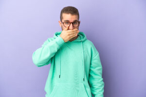 man worried covering mouth tooth loss concept