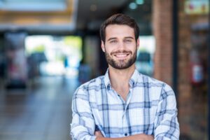 Smiling man with short beard