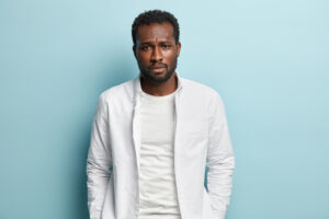 Man in white shirt on blue background