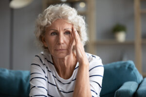 concerned woman holding head